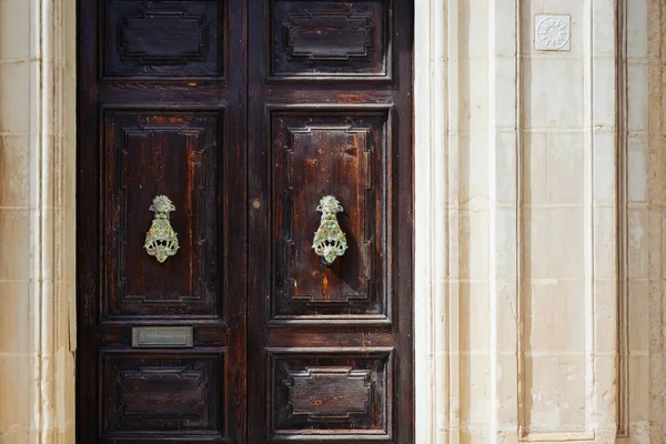 Traditional maltese doors with vintage door knockers