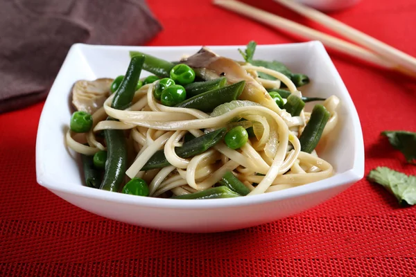 Tasty noodles with green beans — Stock Photo, Image