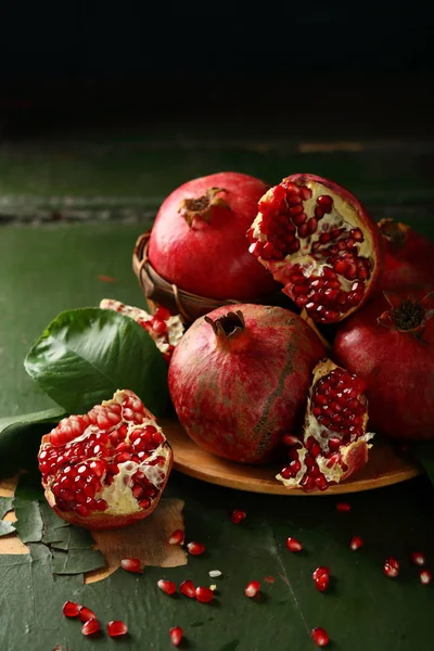 Sweet open pomegranates on plate — Stock Photo, Image