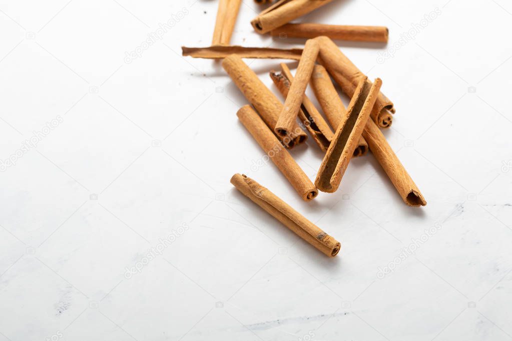 Fresh cinnamon sticks close-up, spice on white background