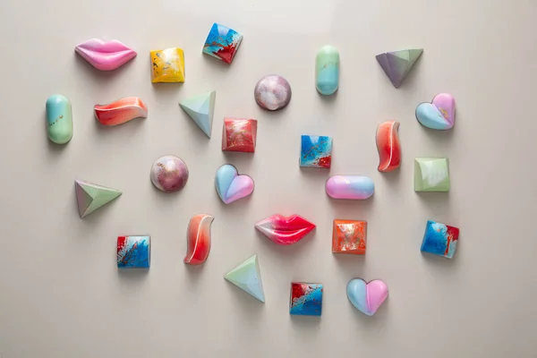 Modern chocolate candies on light surface — Stock Photo, Image