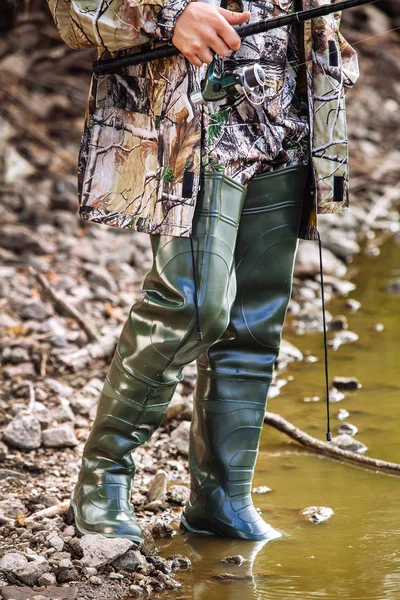 Fisherman Stands Rubber Boots Colors Khaki Fishing Rod His Hands — Stock Photo, Image