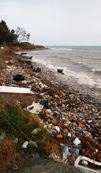 Environmental issue by the sea with garbage in the water