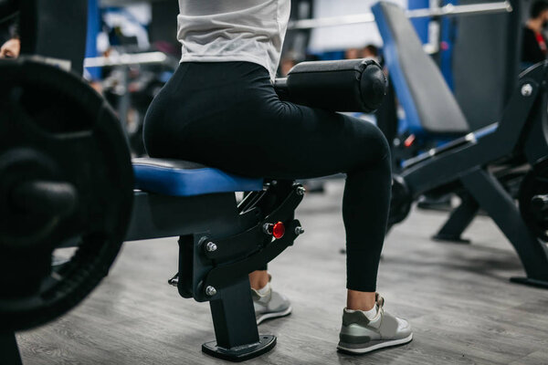 booty and legs of a girl in a sports hall