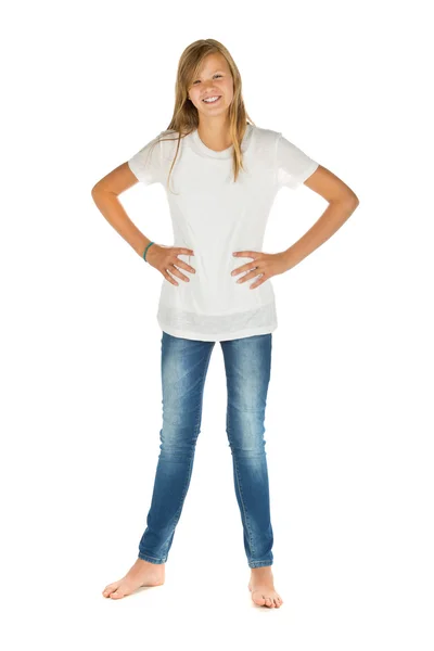 Young girl standing with white t-shirt and blue jeans over white — Stock Photo, Image