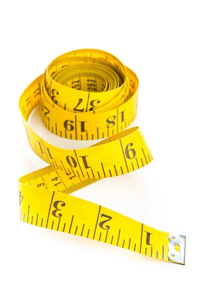 Yellow measure tape on white background — Stock Photo, Image