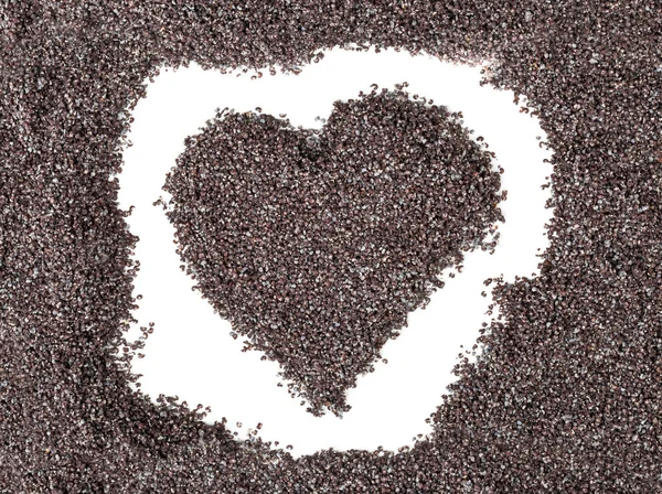 Haşhaş tohumu tarafından kurulan kalp şekli — Stok fotoğraf