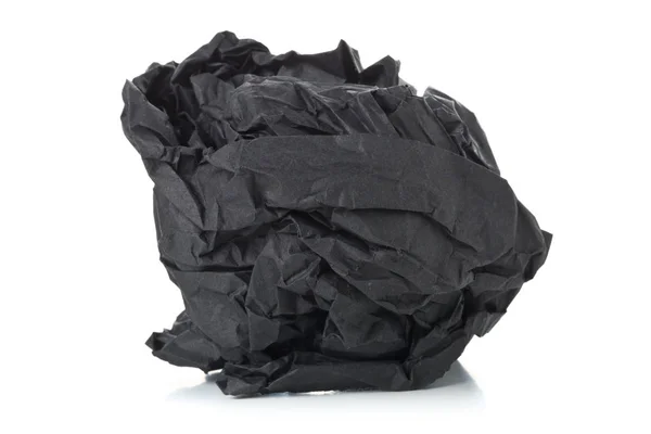 Crumbled zwart papier bal op witte achtergrond — Stockfoto