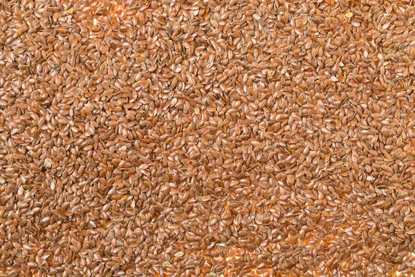 Ham, işlenmemiş keten tohumu ya da keten tohumu arka plan dolgu çerçeve — Stok fotoğraf