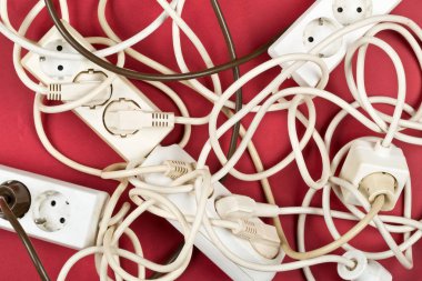 Cable chaos clutter from multiple electric wire extension cords  clipart