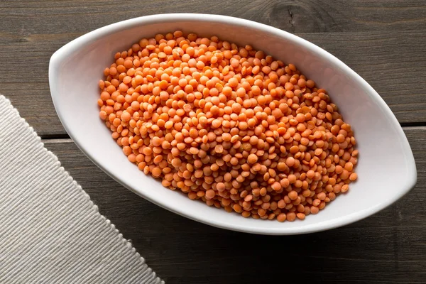 Raw red, dried  lentils in white bowl — Stock Photo, Image