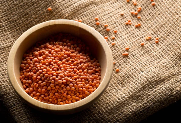 Raw red, dried  lentils in wooden bowl — Stock Photo, Image