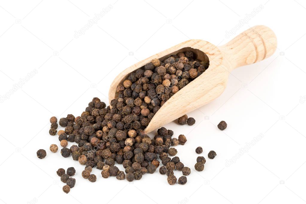 Heap of raw, natural, unprocessed black pepper peppercorns in sc