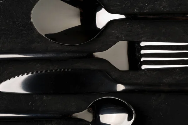 Kitchen cutlery set on dark background — Stock Photo, Image