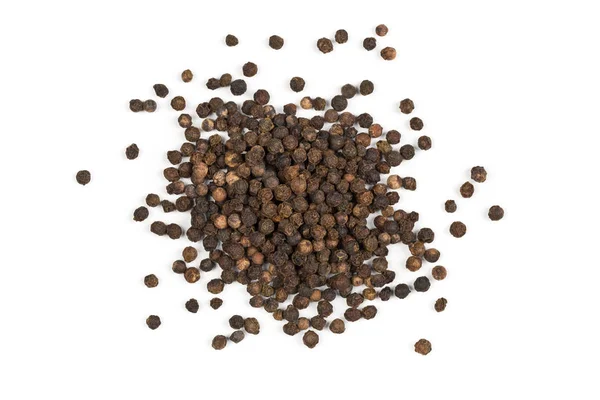 Un mucchio di grani di pepe nero crudi, naturali e non trasformati — Foto Stock