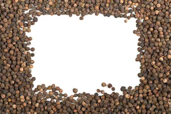 Frame of raw, natural, unprocessed black pepper peppercorns — Stock Photo, Image