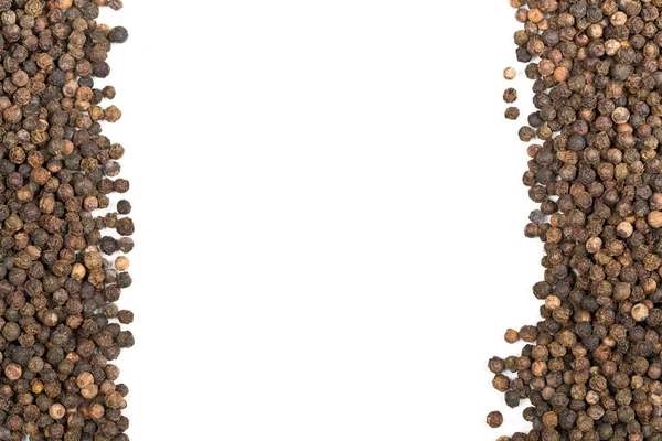 Frame of raw, natural, unprocessed black pepper peppercorns — Stock Photo, Image