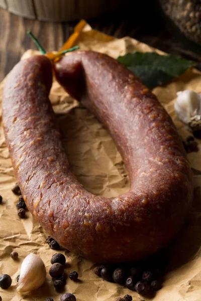 German specialty salami hard cured sausage whole with spices on — Stock Photo, Image