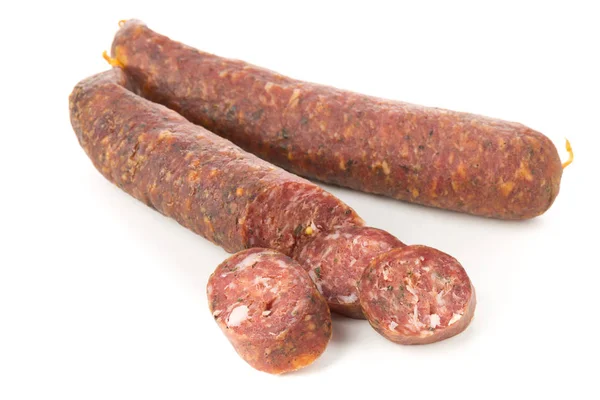 German specialty salami hard cured sausage whole and sliced over — Stock Photo, Image