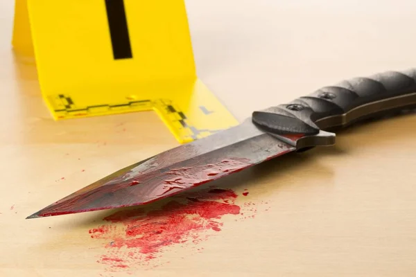 Crime scene investigation CSI evidence marker with bloody knife — Stock Photo, Image