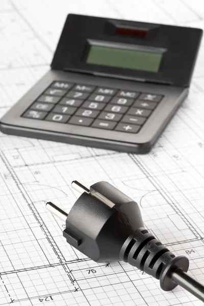 Power cord, plug and calculator on building construction blueprint — Stock Photo, Image