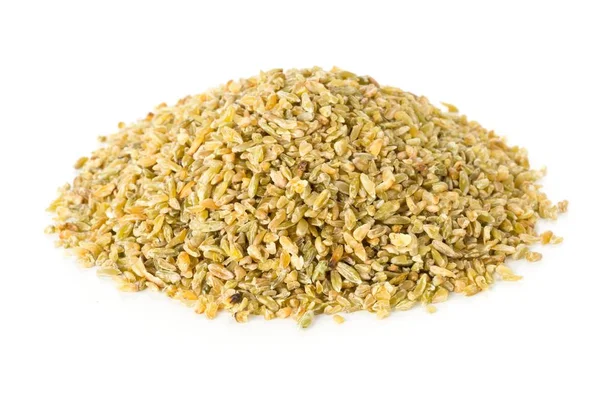 Heap of uncooked, raw freekeh or firik, roasted wheat grain — 스톡 사진