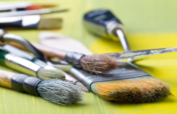 Artistic Art Supply Utensils Paintbrushes Yellow Canvas Background Selective Focus — Stock Photo, Image