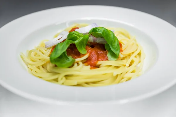 Spaghetti with tomato sauce pachino with fresh basil