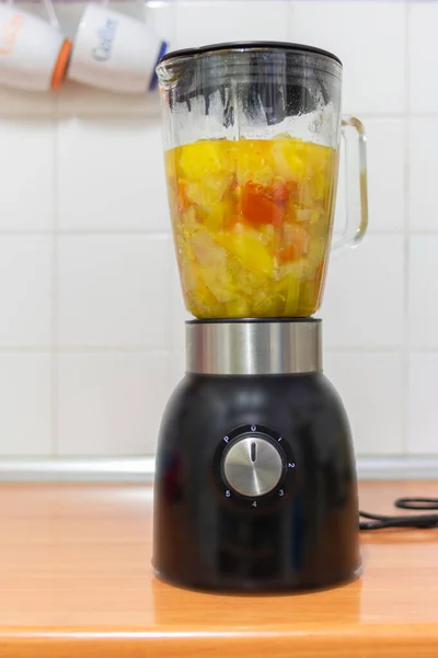 a blender full of vegetable pieces ready to run