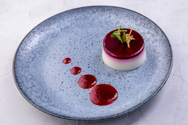 Panna cotta. North Italian dessert made from cream, sugar, gelatin and vanilla. European cuisine. The work of a professional chef. Dish from a restaurant or cafe menu.