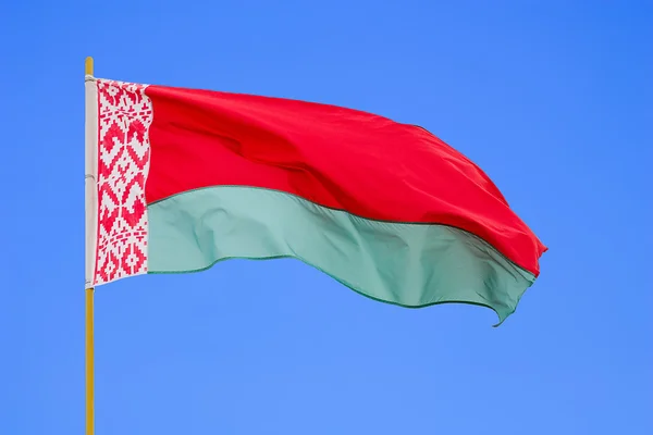 Belarus flag is waving in front of blue sky