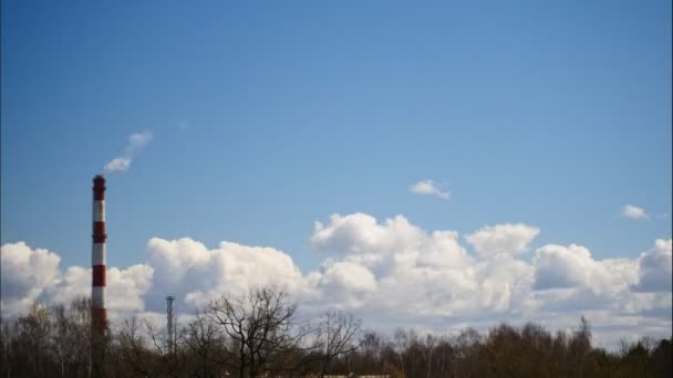 Time Lapse Sky and moving clouds Power Plant pipe with smoke Latvia 4K — Stock Video