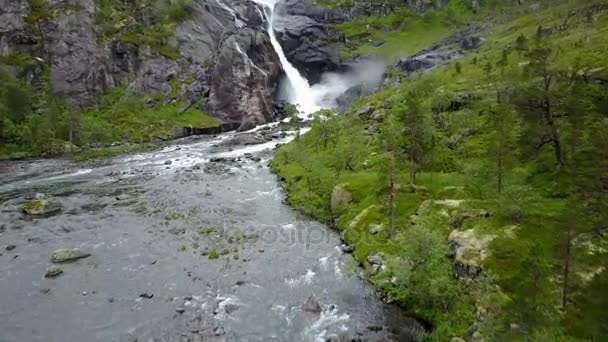 Waterfall in mountains of Norway in rainy weather from air view from drone — Stock Video