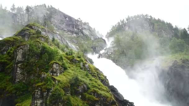 Waterfall in mountains of Norway in rainy weather. — Stock Video