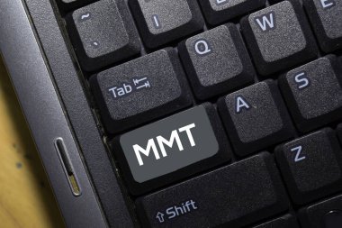 MMT write on keyboard isolated on laptop background clipart