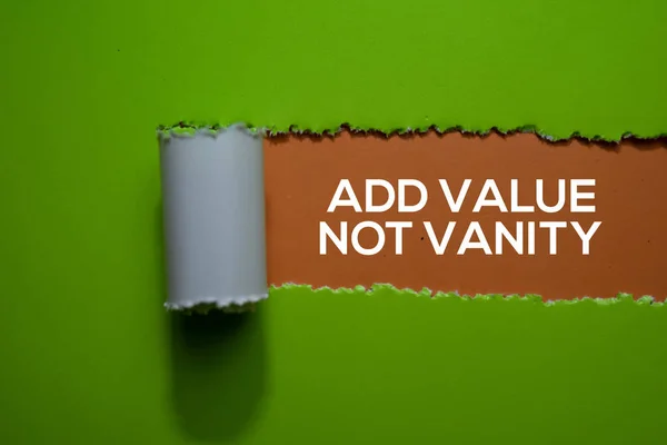 Add Value Not Vanity Text written in torn paper — ストック写真