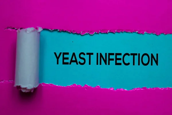 Yeast Infection Text written in torn paper. Medical concept