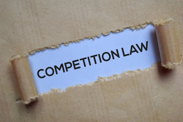 Competition Law Text written in torn paper