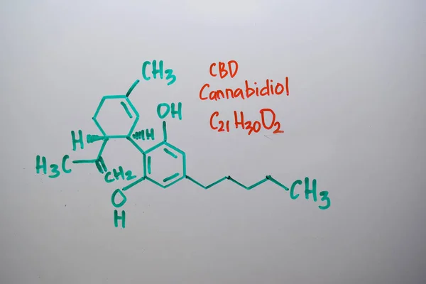 Cannabidiol (CBD) write on the white board. Structural chemical formula. Education concept — ストック写真