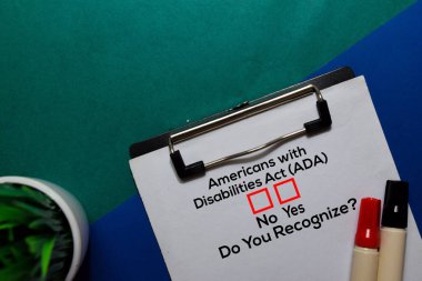 Americans with Disabilities Act (ADA), Do You Rezognize? Yes or No. On office desk background clipart