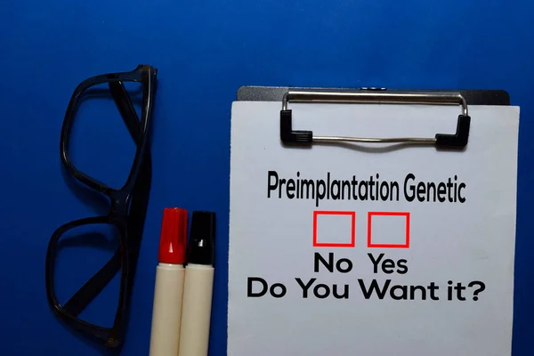 Preimplantation Genetic, Do You Want it? Yes or No. On office desk background