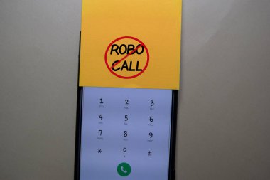 Robocall write on a sticky note isolated on office desk. clipart