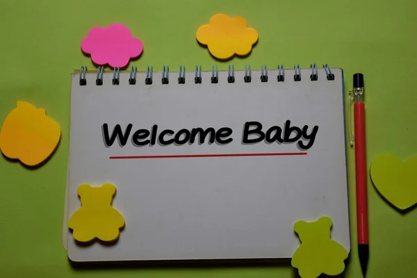 Welcome Baby write on a book isolated on office desk. — Stock Photo, Image