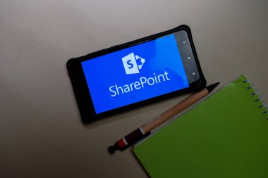 BEKASI, WEST JAVA, INDONESIA. FEBRUARY 24, 2020 : Microsoft SharePoint dev app on Smartphone screen. SharePoint is a freeware web browser developed by Microsoft Corporation clipart