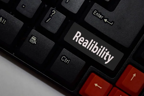 Reliability isolated on laptop keyboard background