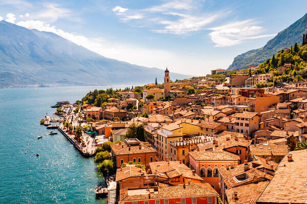 Limone Sul Garda cityscape on the shore of Garda lake surrounded by scenic Northern Italian nature. Amazing Italian cities
