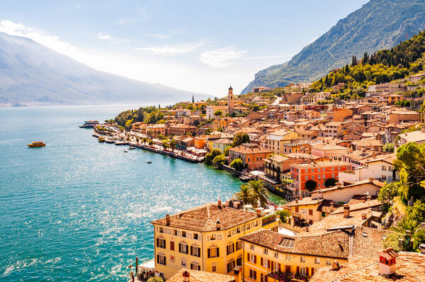 Limone Sul Garda cityscape on the shore of Garda lake surrounded by scenic Northern Italian nature. Amazing Italian cities