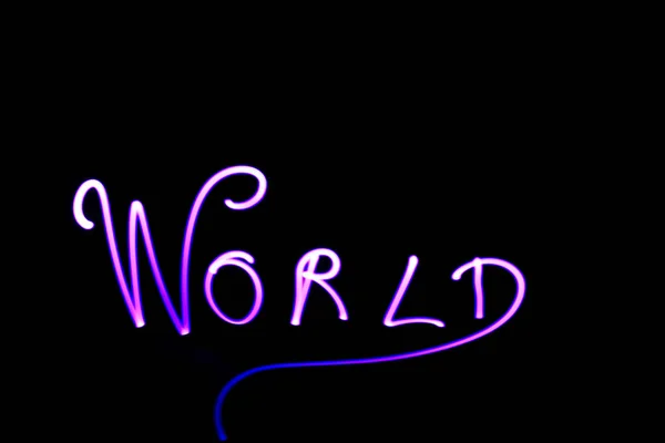 Woord Wereld Geschreven Met Een Led Lamp Tijdens Een Lichtschildersessie — Stockfoto