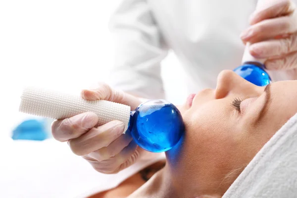 Cosmetic treatment, facial massage glass balls — Stock Photo, Image