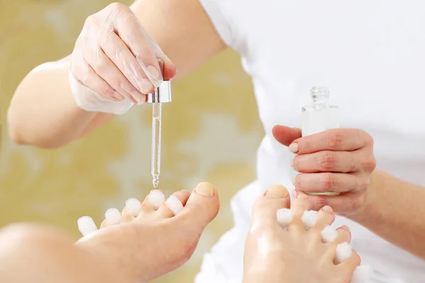 Pedicure. Essential oil for skin care, beautiful feet. — Stock Photo, Image